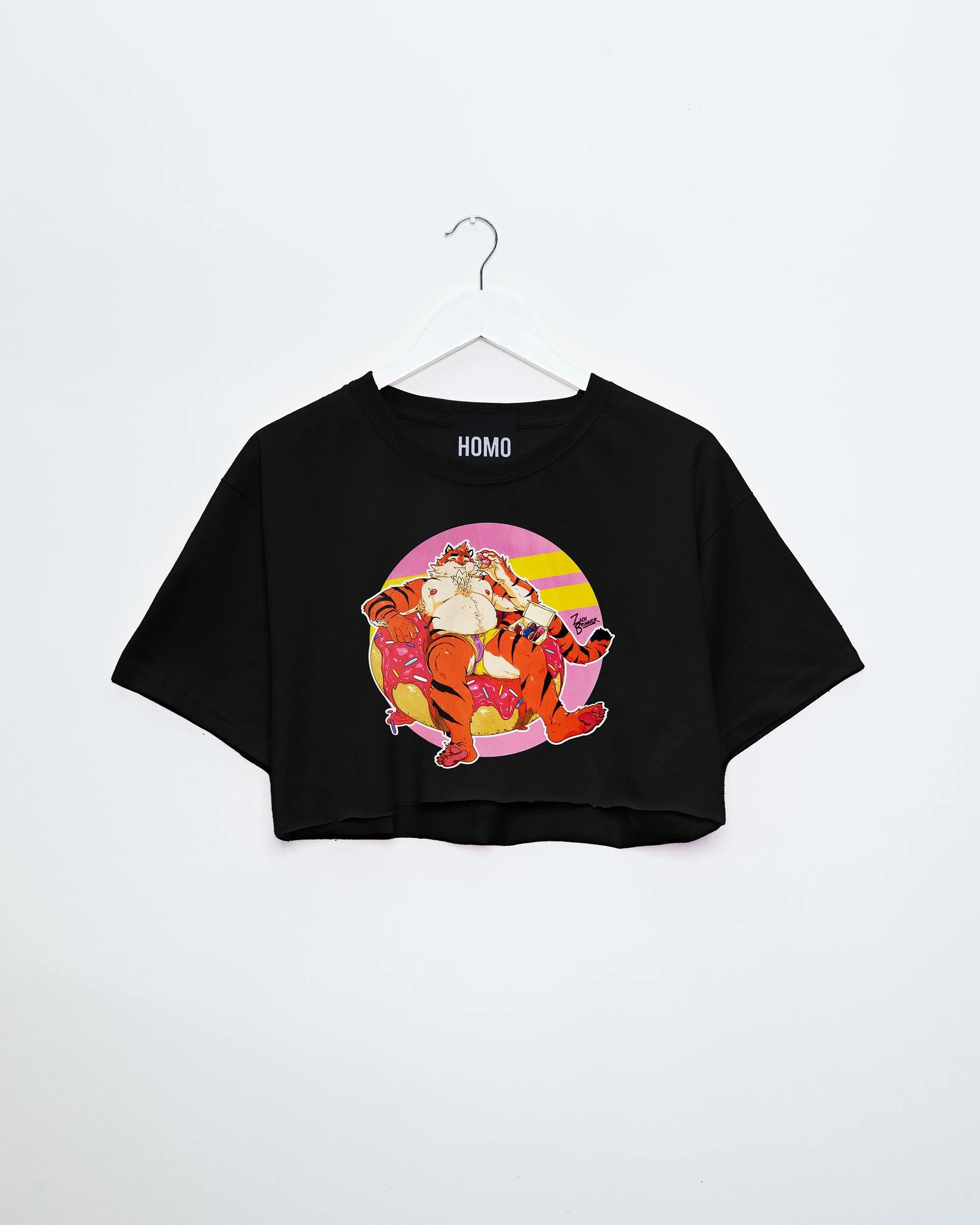 Flint the tiger eats doughnuts on black - mens crop top